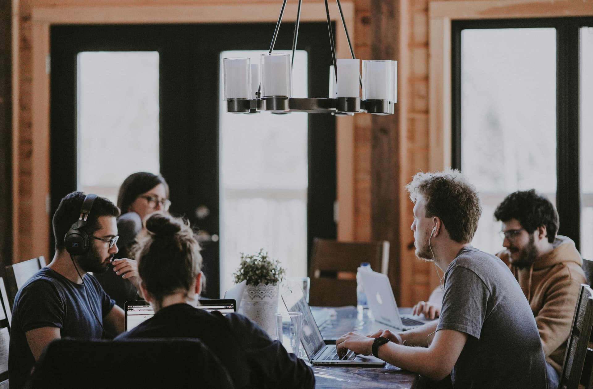 Diverse team of founders collaborating on an impact-driven tech startup project